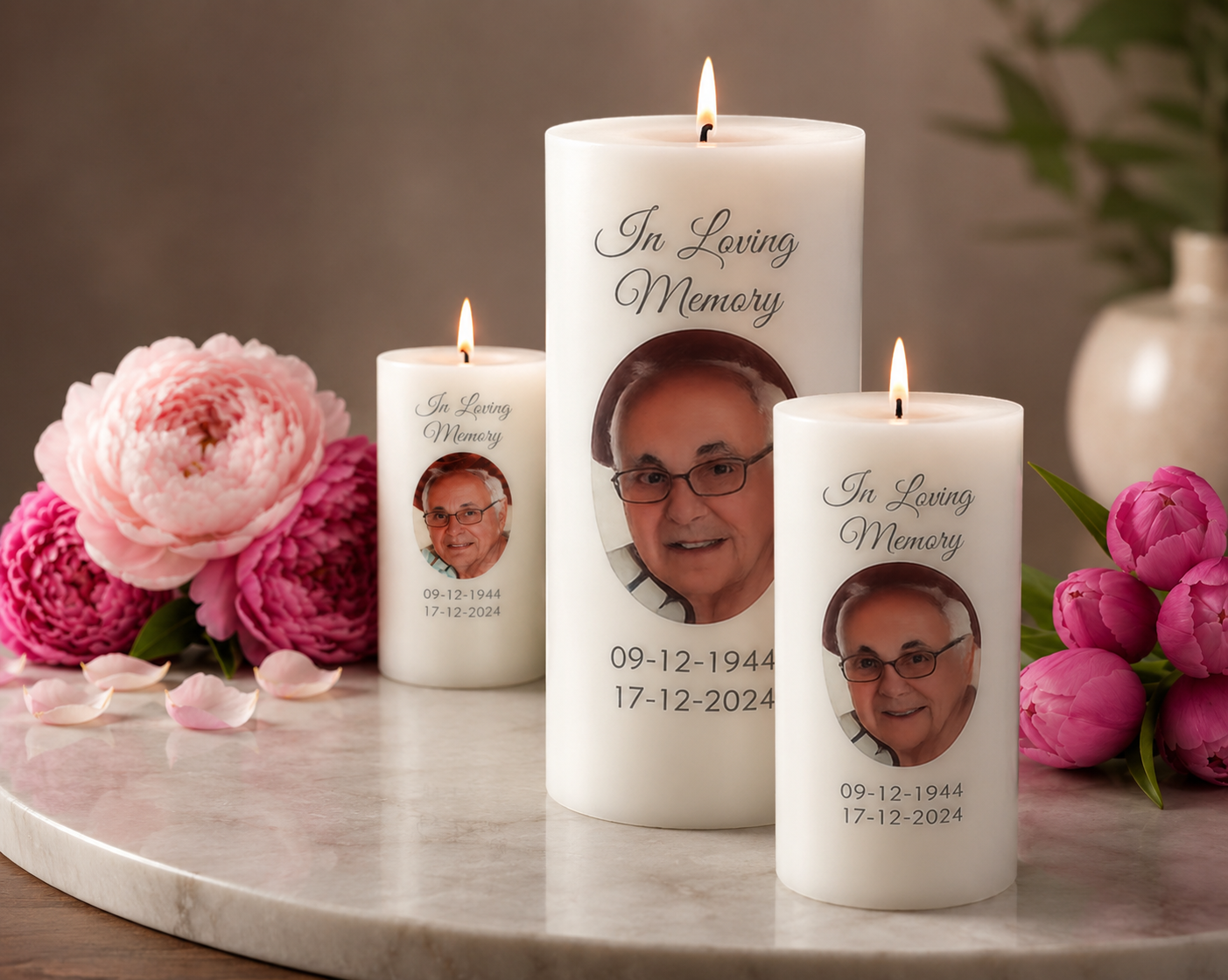 Professional memorial candle arrangement with pink flowers